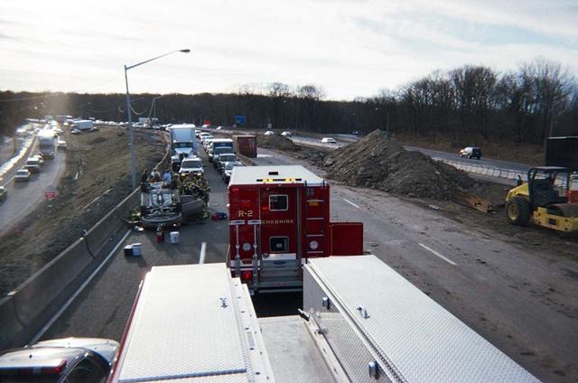 Cheshire Rescue 1 and Rescue 2 work this motor vehicle rollover on Interstate 84 near the Waterbury Road overpass.